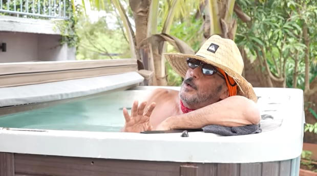 Jackie Shroff farmhouse exterior showing lush greenery, swimming pool and 44,000 square feet of landscaped property